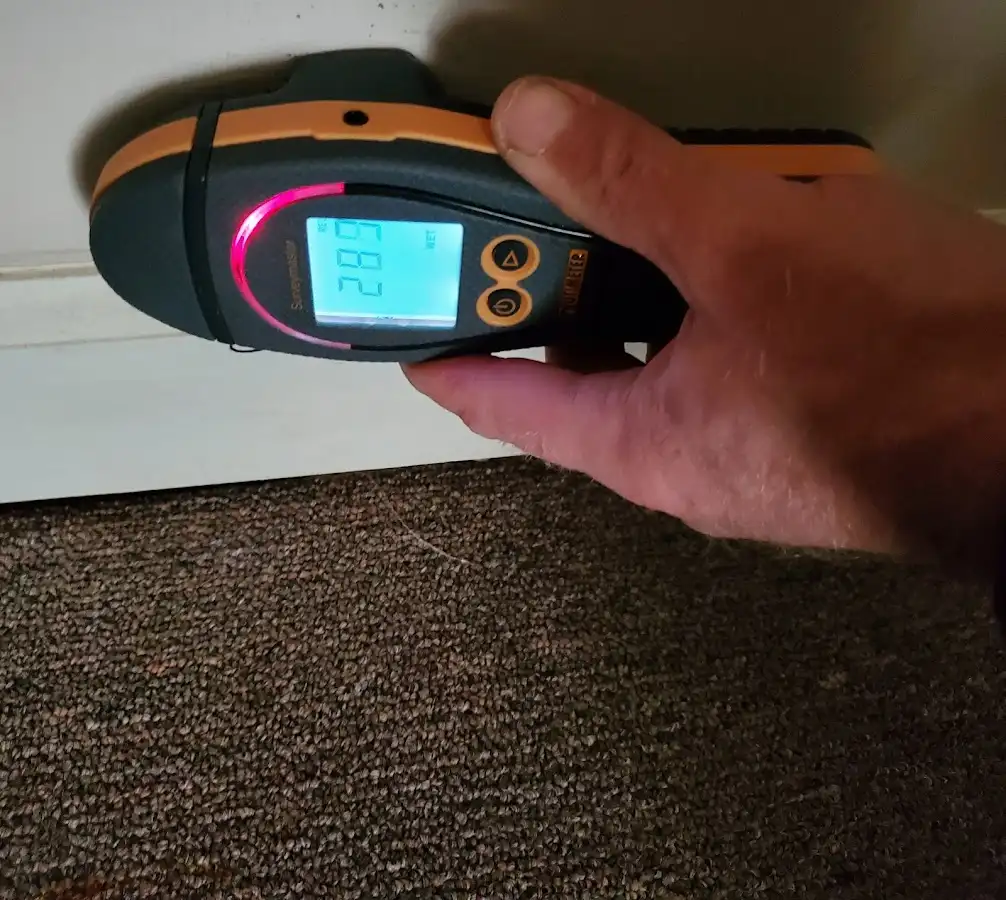 Moisture detection at baseboard during Storm Damage Restoration in Lincolnton